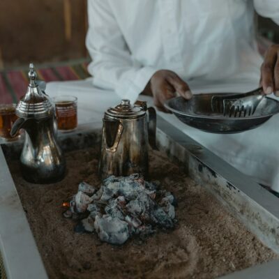 Man in White Dress Shirt Holding Stainless Steel Tray